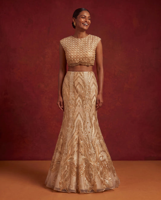 Golden bead work mermaid lehenga, smiling front view