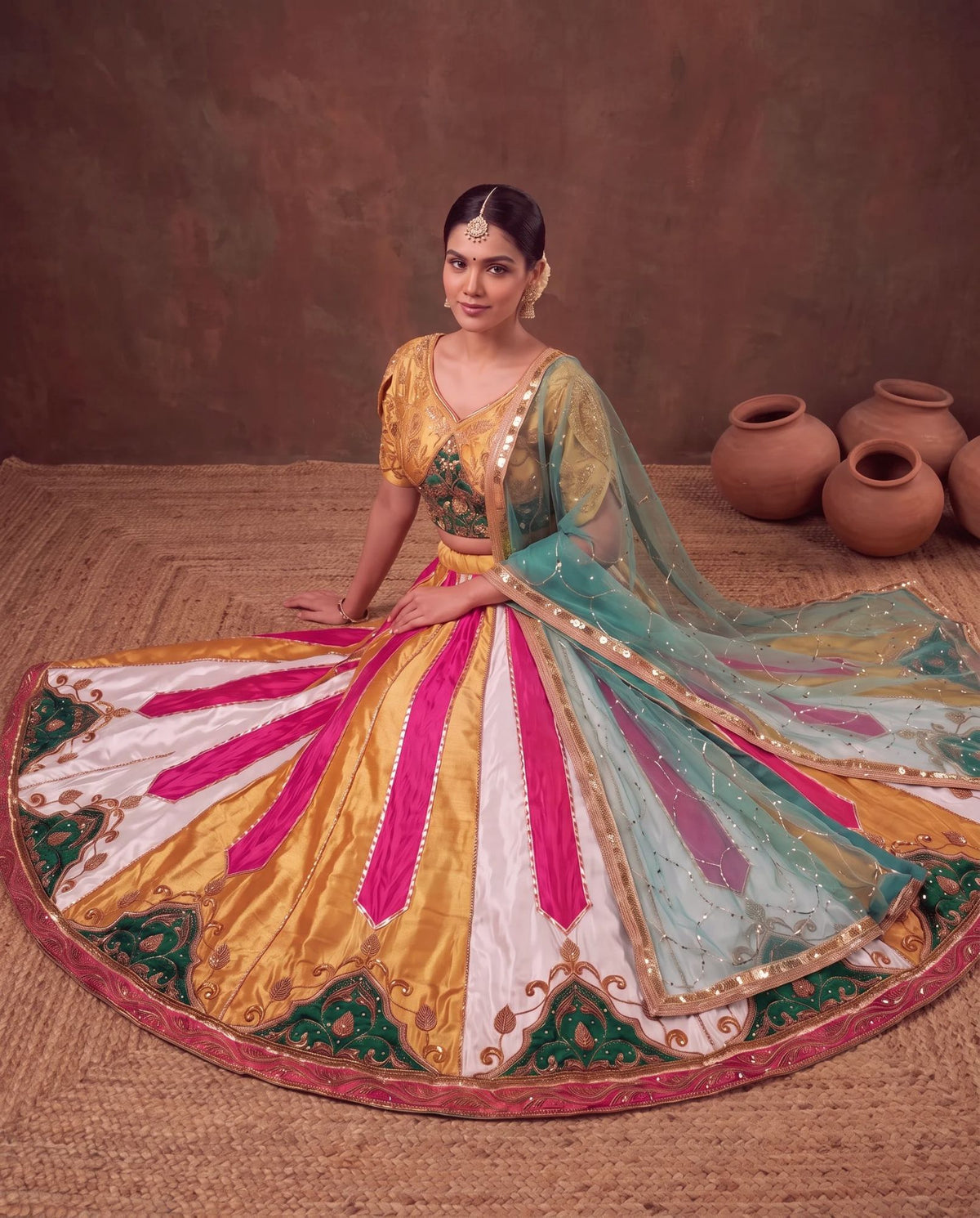 Multicolour lehenga, seated, hem embroidery