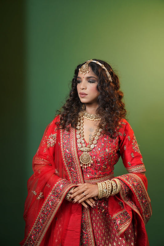 Red silk bridal lehenga from House of Daisy