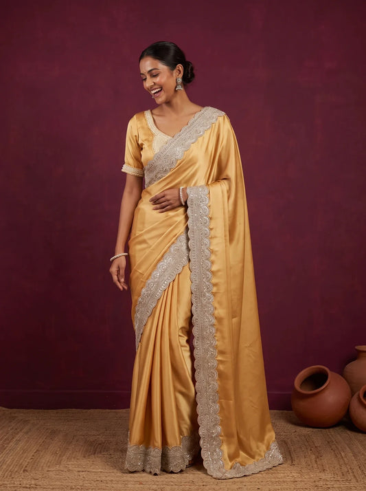 Golden satin saree from House of Daisy, the kind of fabric that can become a lehenga