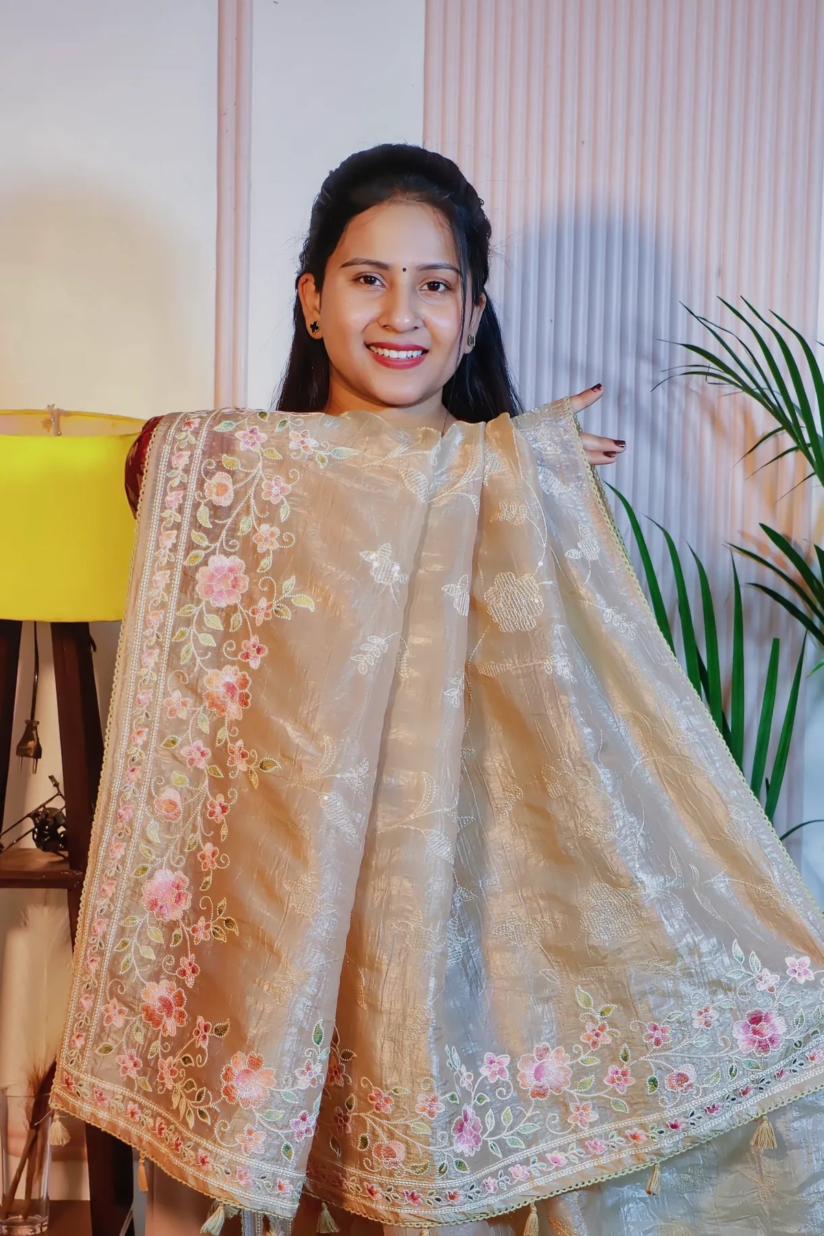 Beige silk saree, pallu held open to show the embroidery