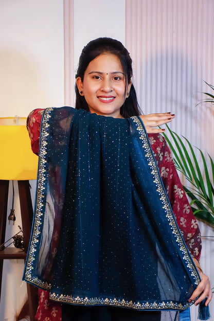 Navy blue georgette saree, held open to show the all-over work