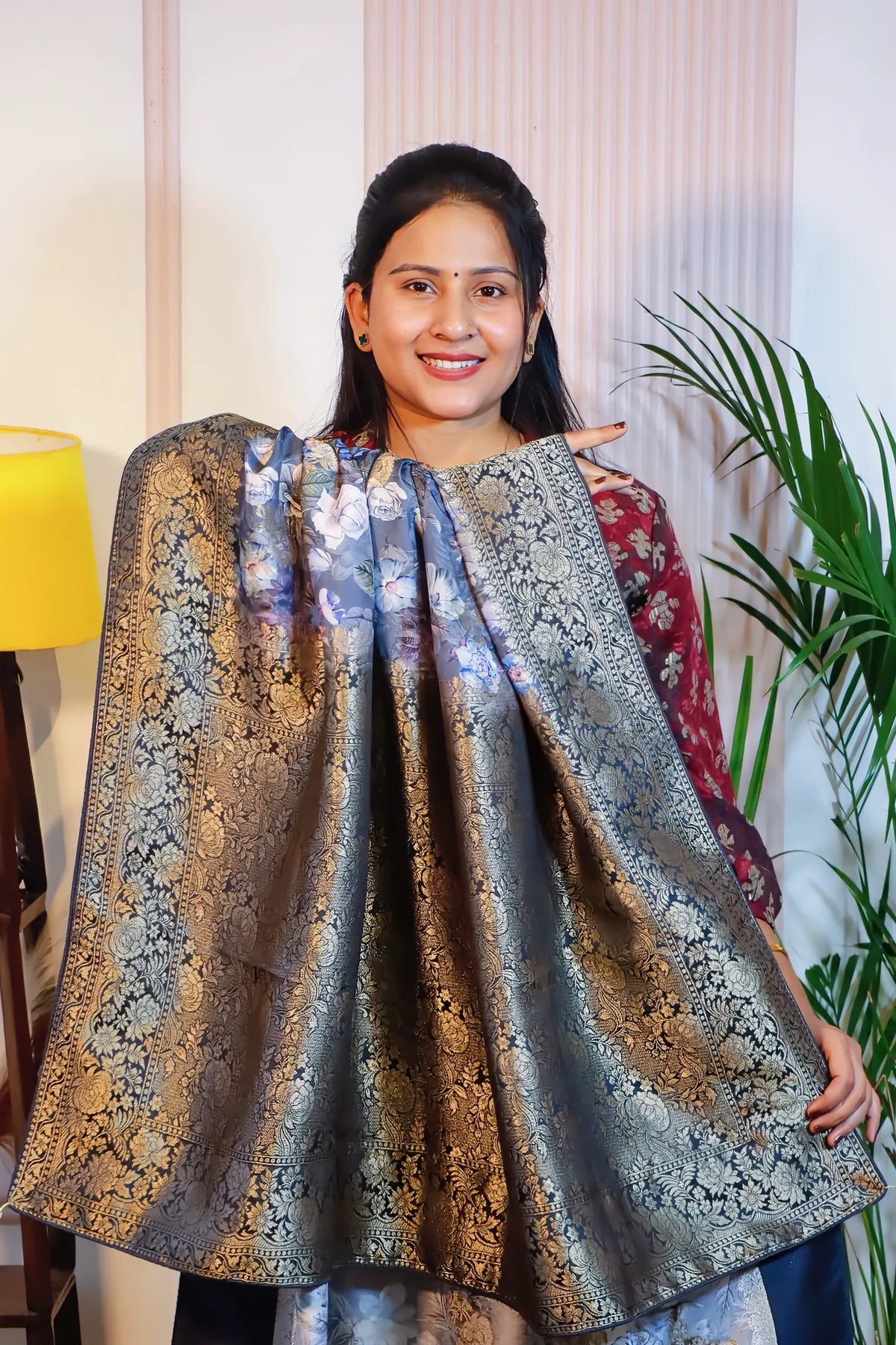 Grey silk saree, pallu held open to show the zari weave