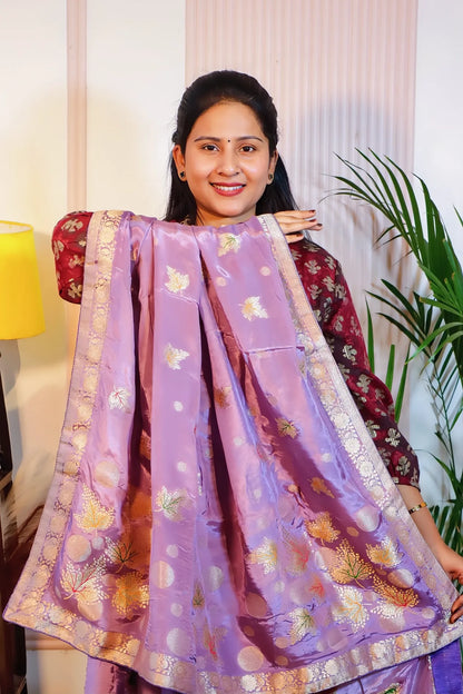 Purple silk saree, pallu held open to show the zari weave