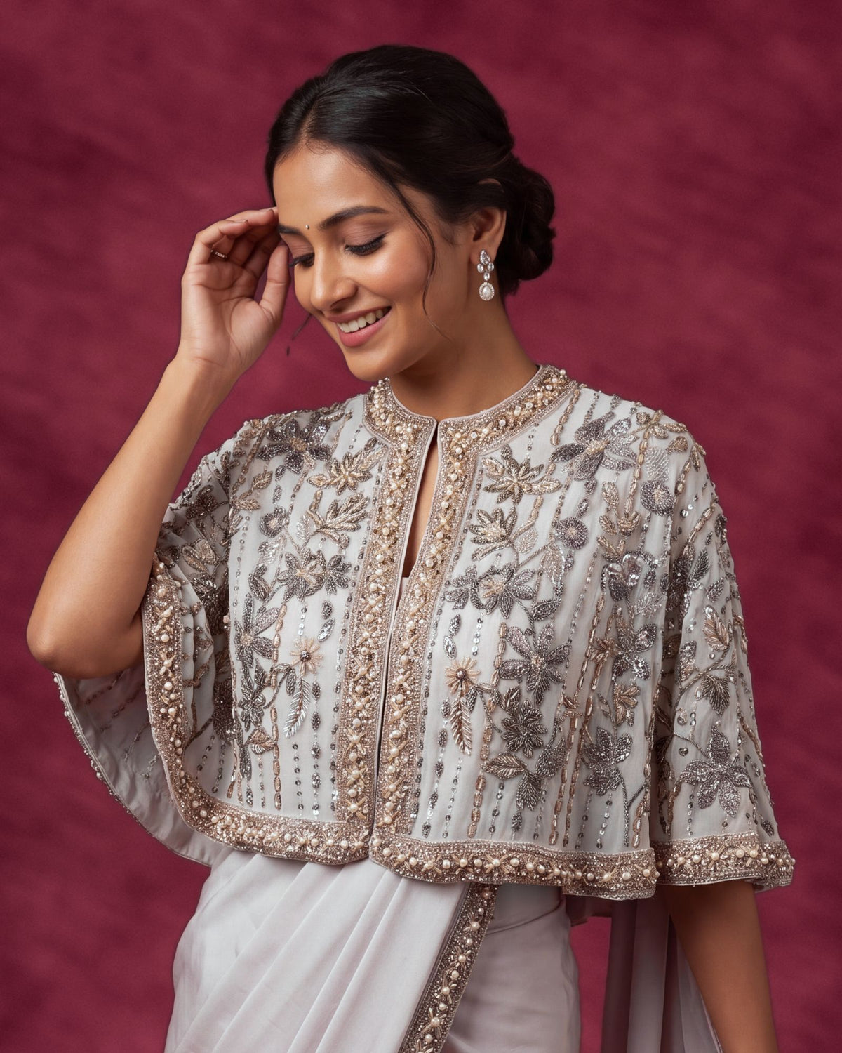 Heavenly pink cape saree, stone and pearl work close up