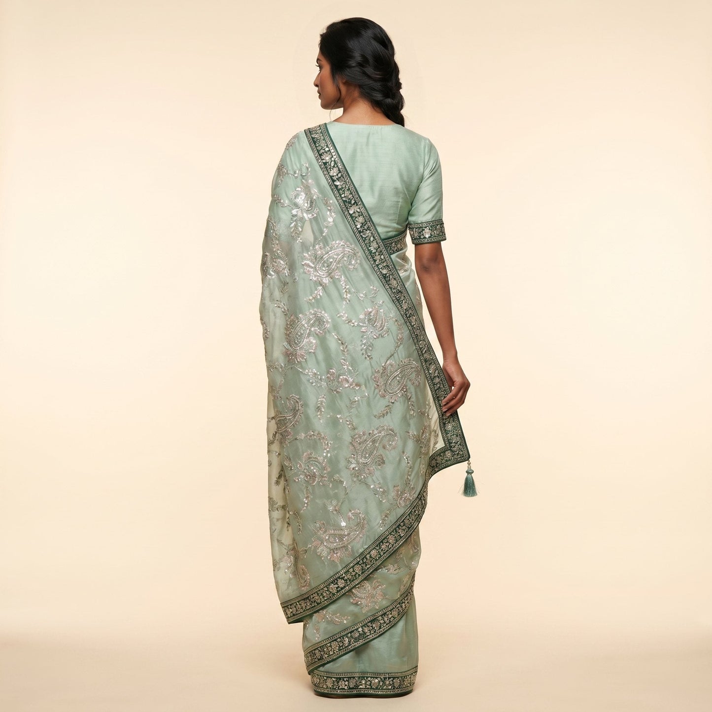 Elegant Mint Green Embroidered Saree on model - back