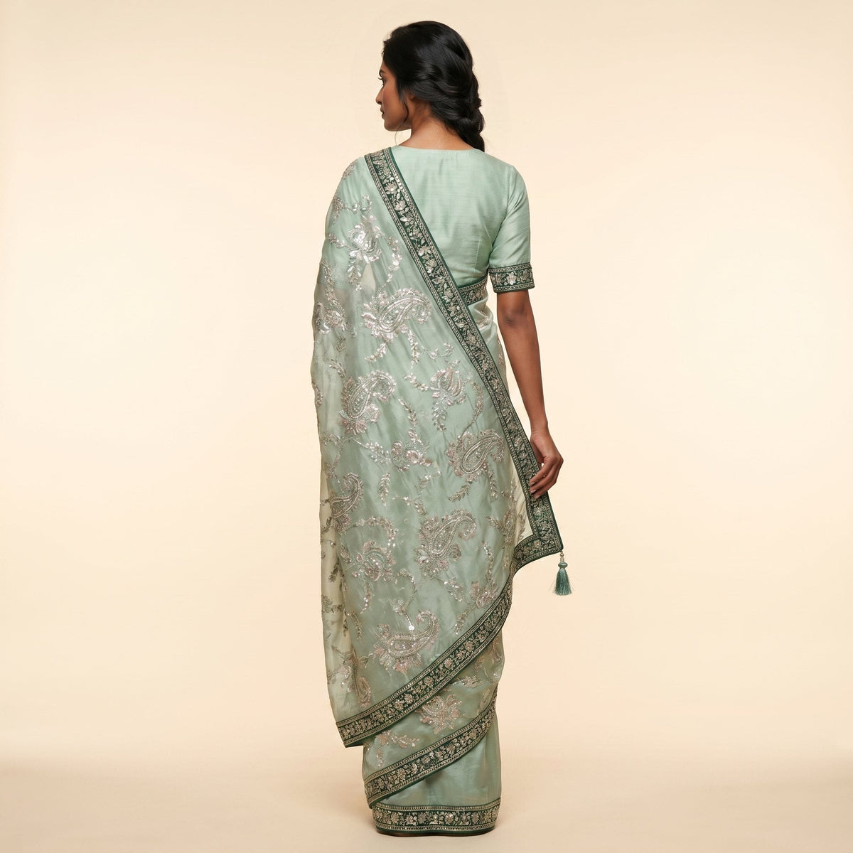 Elegant Mint Green Embroidered Saree on model - back