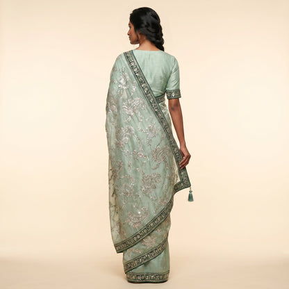 Elegant Mint Green Embroidered Saree on model - back