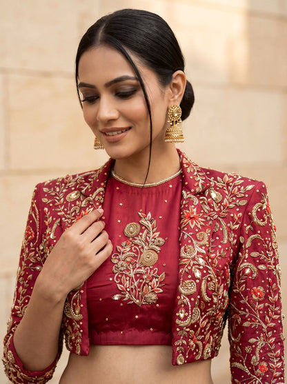 Maroon lehenga with cropped jacket, blouse and jacket embroidery close up