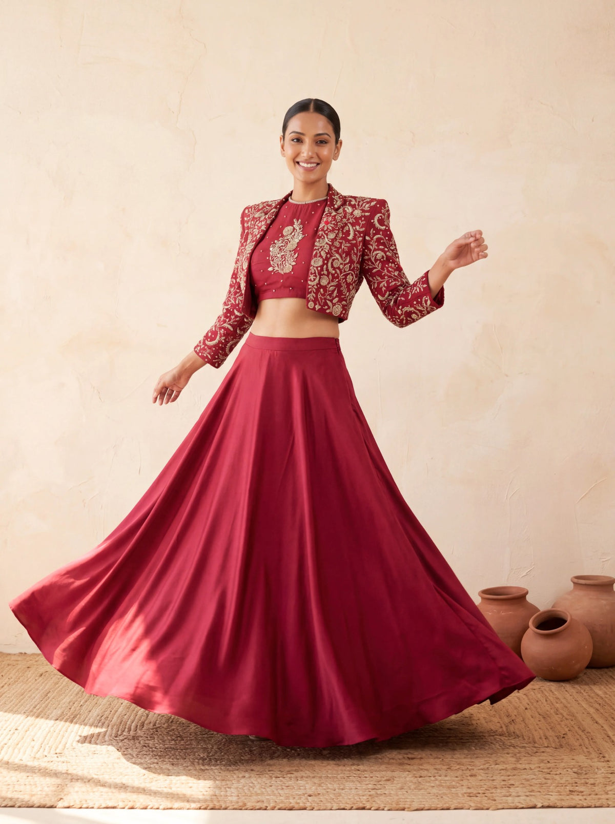 Maroon lehenga with cropped jacket, skirt in movement