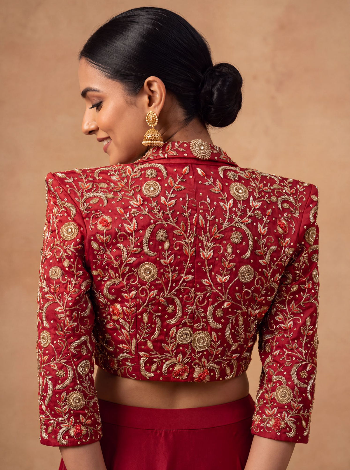 Maroon lehenga with cropped jacket, zardozi on the back of the jacket