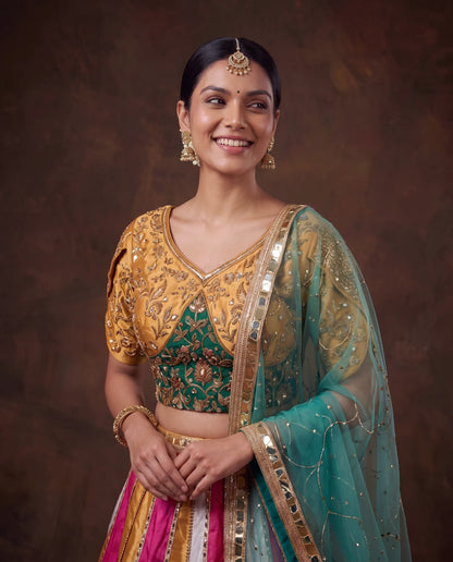 Gold and green embroidered blouse, close up