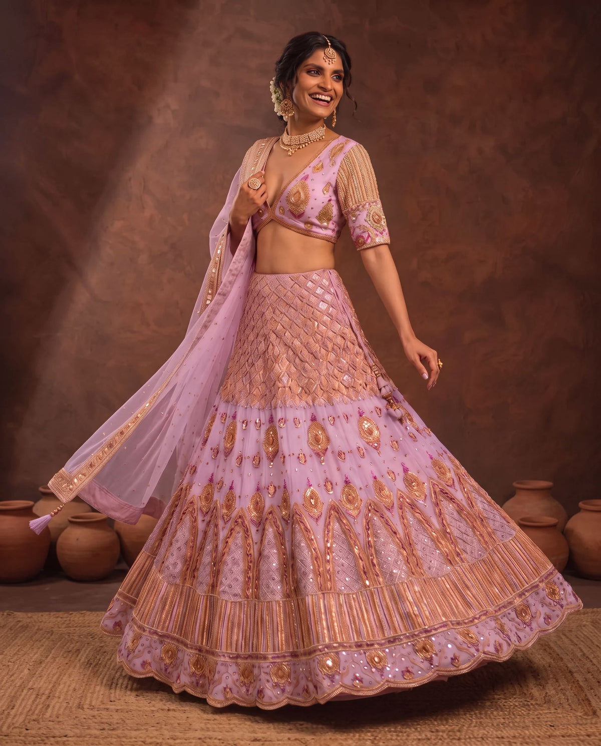 Pastel pink lehenga in movement, embroidered skirt