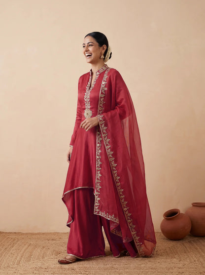 Red frock with drape pants, dupatta over the shoulder
