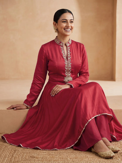 Red frock with drape pants, seated