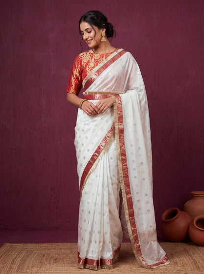 White chanderi saree with red brocade blouse, front