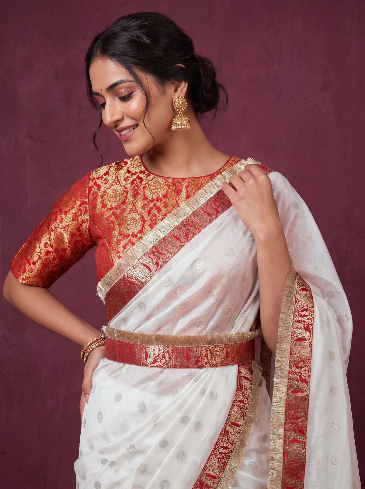 Red brocade blouse and saree border close up