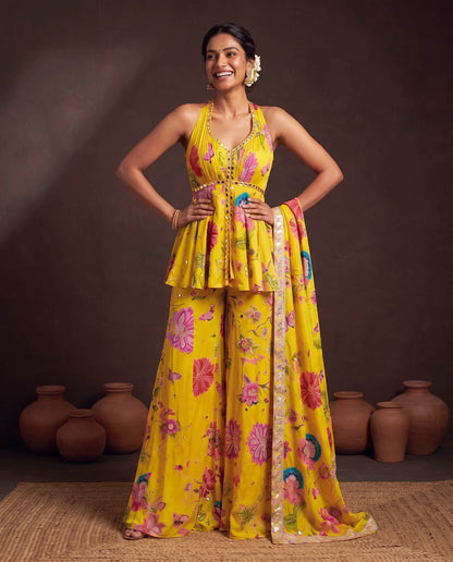 Yellow printed crepe suit, hands on hips